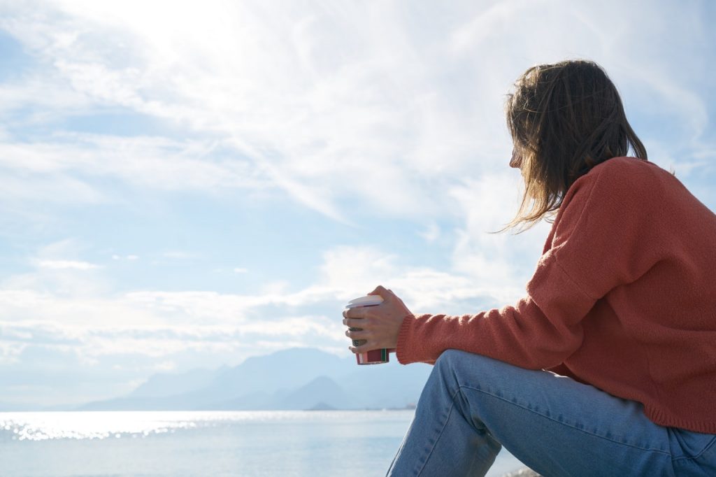 a person sitting on a beach