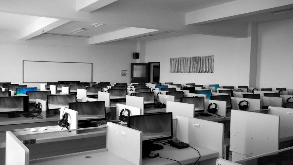 an empty office with computers