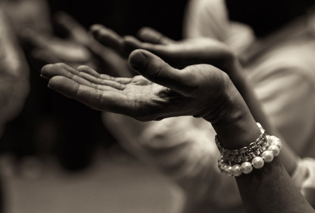 a close-up of hands shaking