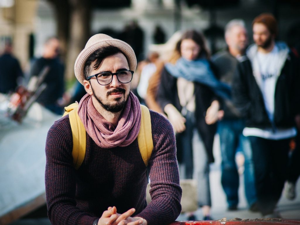 a person with a beard and a hat