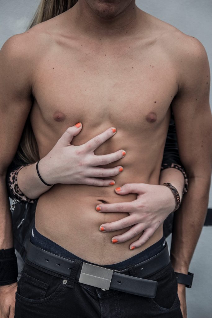 a person with the hands on the chest