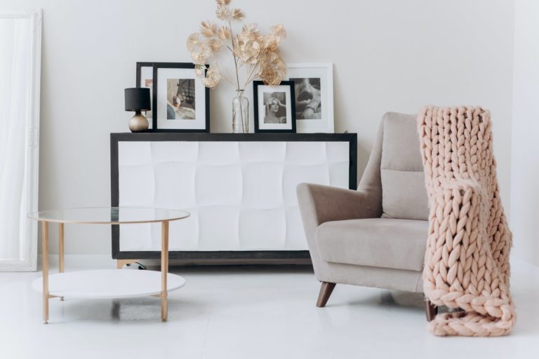 a living room with a white couch and a coffee table