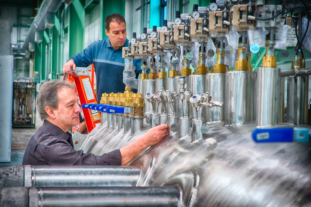 a man and a woman working in a factory