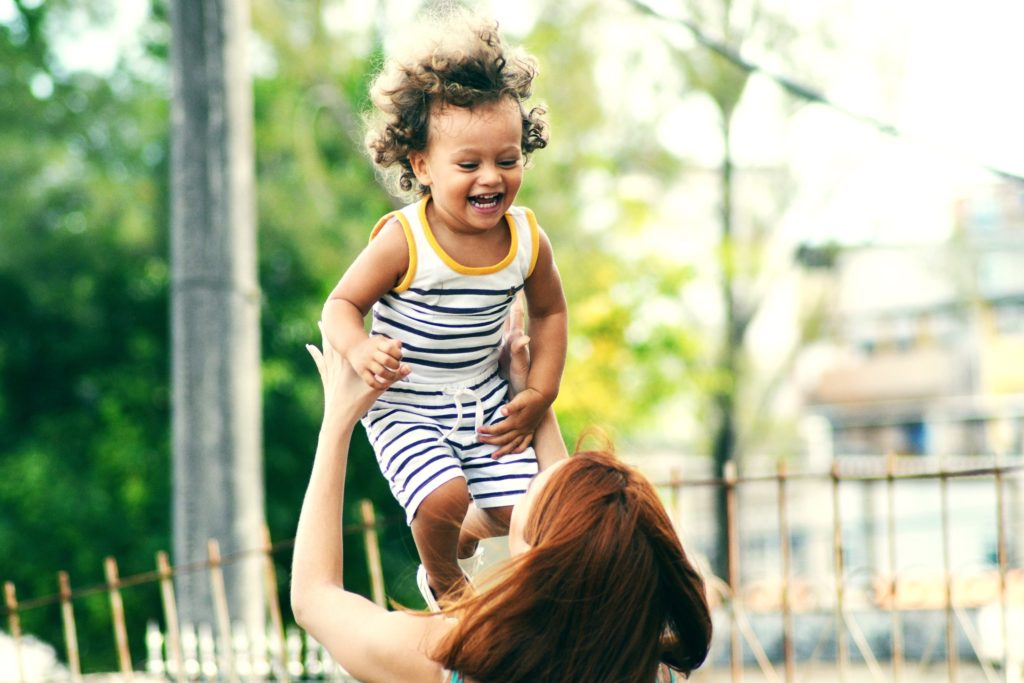 a woman holding a child