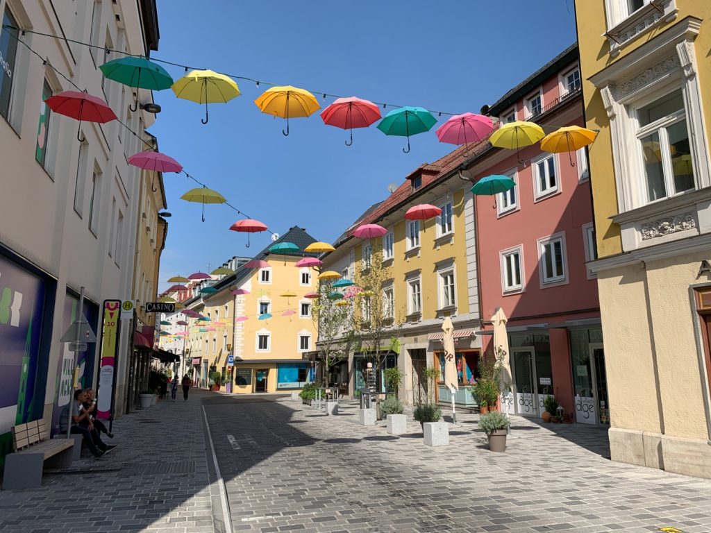 a street with colorful umbrellas