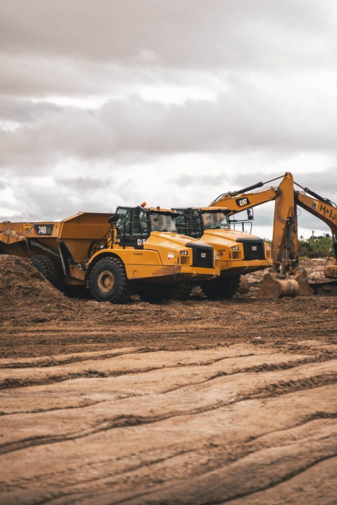 a construction vehicle on a dirt road