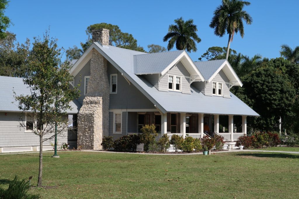 a house with a lawn and trees