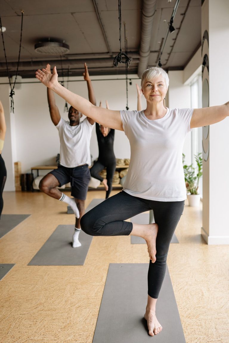 a man and woman doing yoga