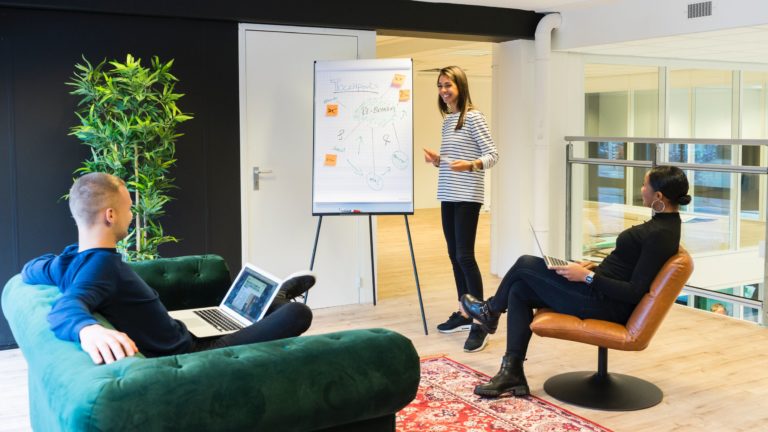 a man and a woman talking in a room