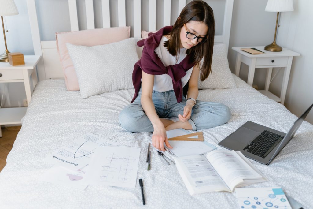 a person sitting on a bed