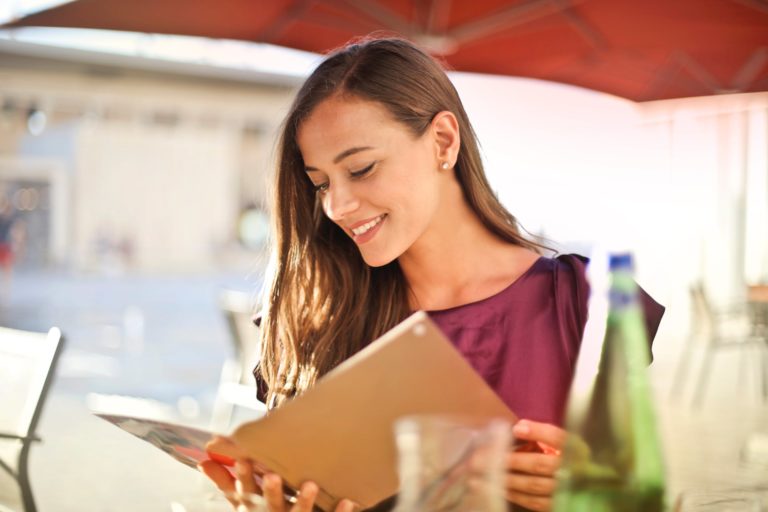 a woman looking at a tablet