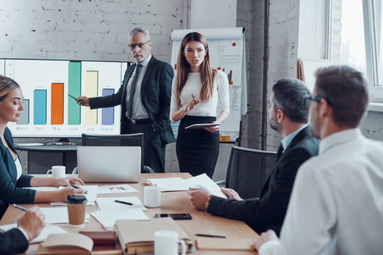 a person giving a presentation to a group of people