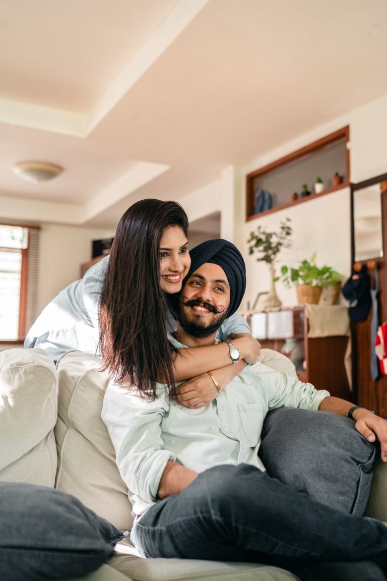 a man and woman sitting on a couch