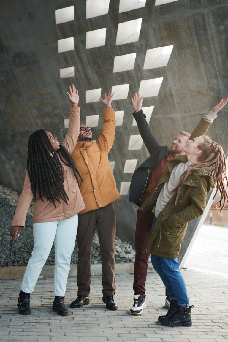 a group of people with their hands up