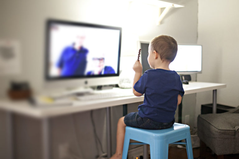 kids laughing and talking to grandparents via the internet on facebook